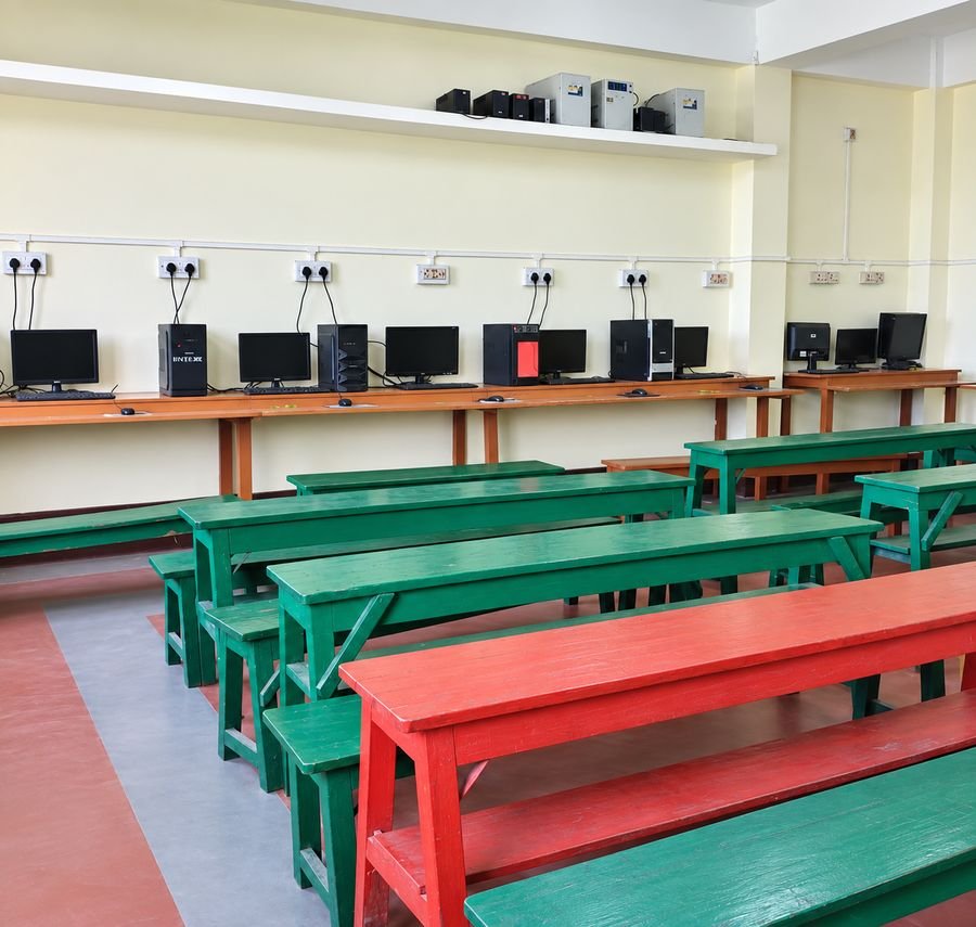 Computer lab at R.T Sishu Sadan English Medium High School with student workstations